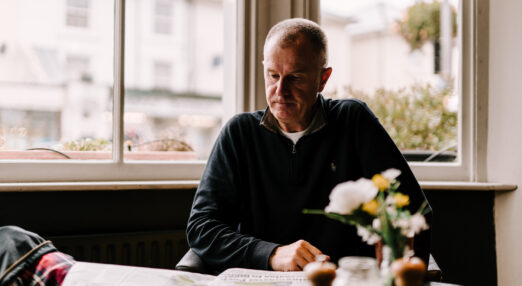 Person sitting reading in a pub