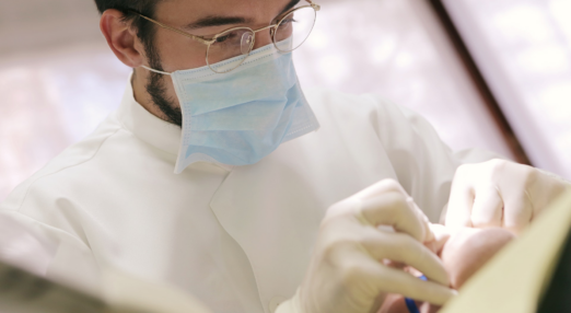 Dentist inspecting a patient.