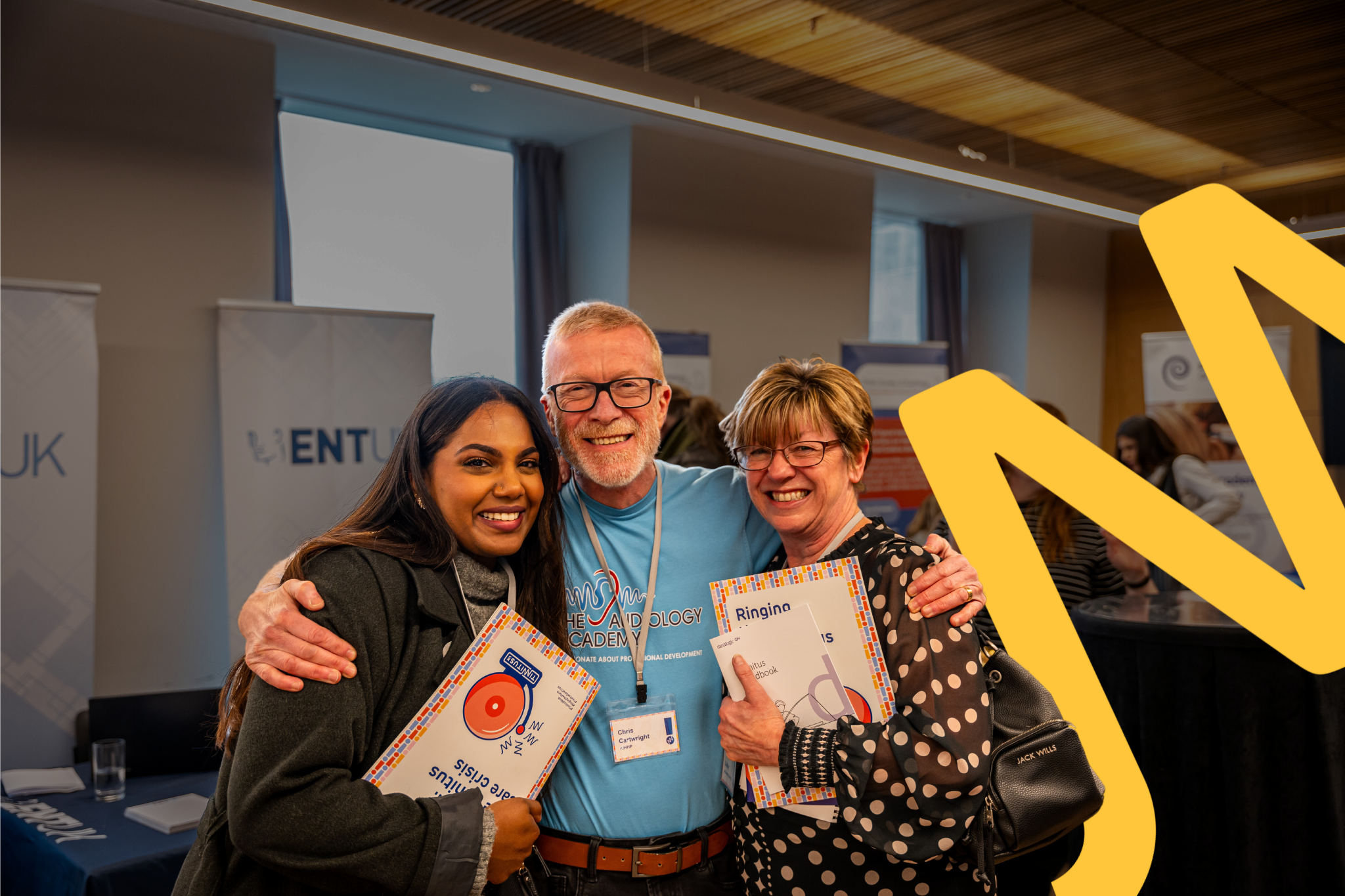 An image of three people smiling